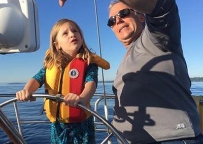 man with kid on boat