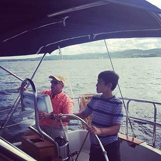 boy with dad on boat
