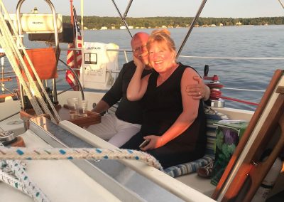 couple smiling on sailboat