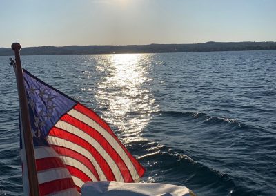 flag on boat with sun