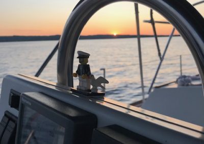 small captain figure on boat