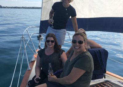 girls smiling on sail boat