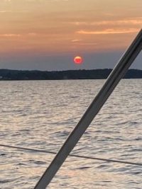 Sunset on grand traverse bay in Traverse City, Michigan with WIND Sailing.