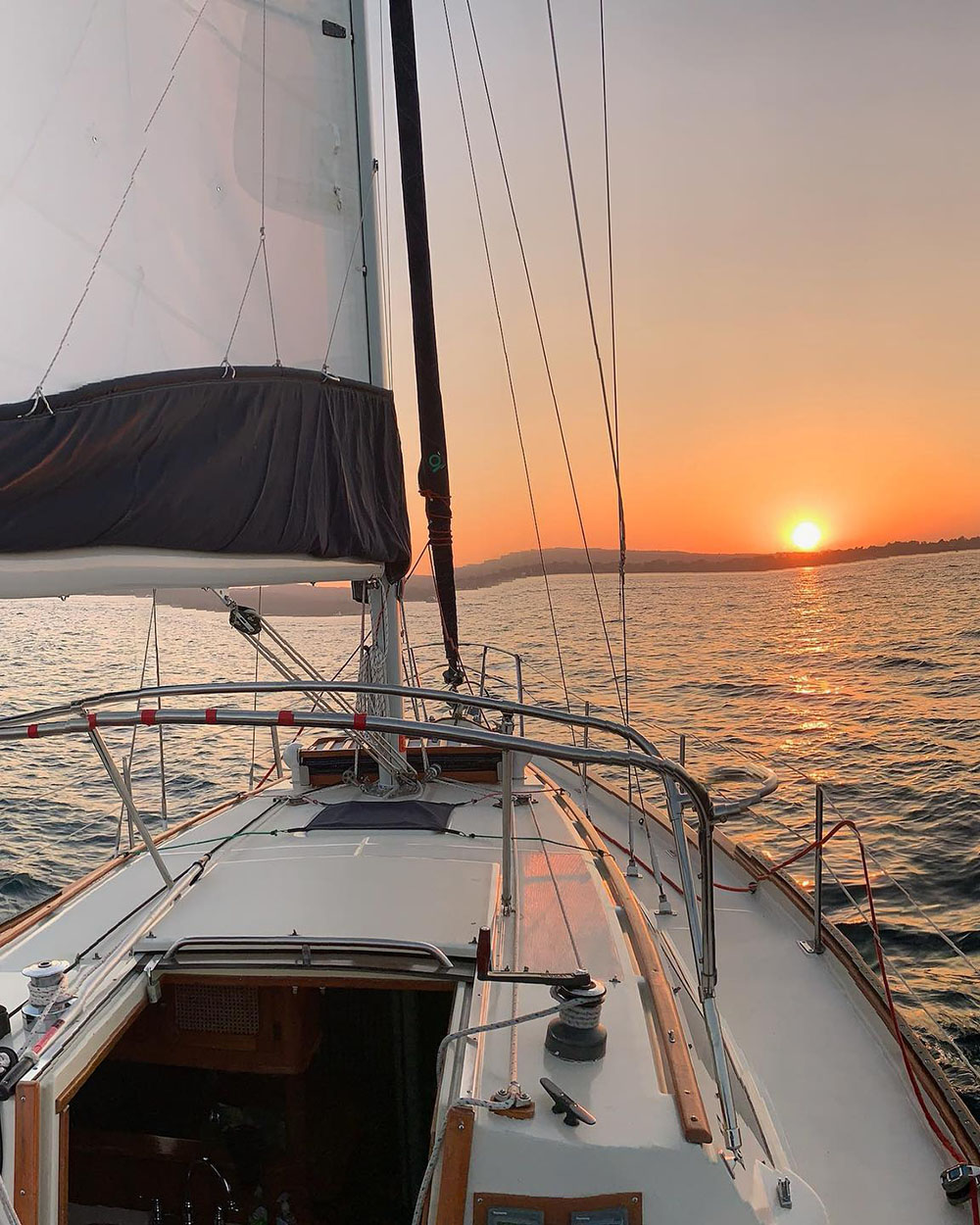 sail boat with sunset